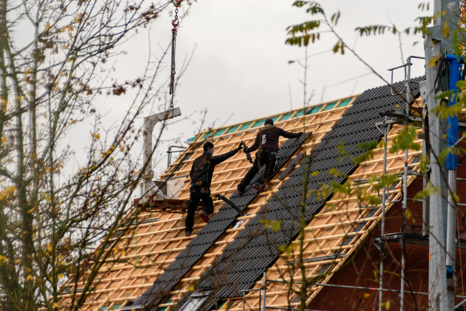 Roofing crew installing a roof